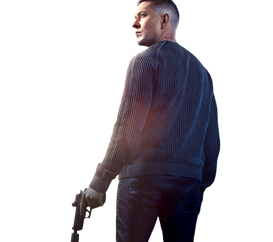 Man with his back turned holding an automatic pistol looking off at the distance